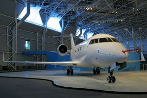 business jet in airport hangar